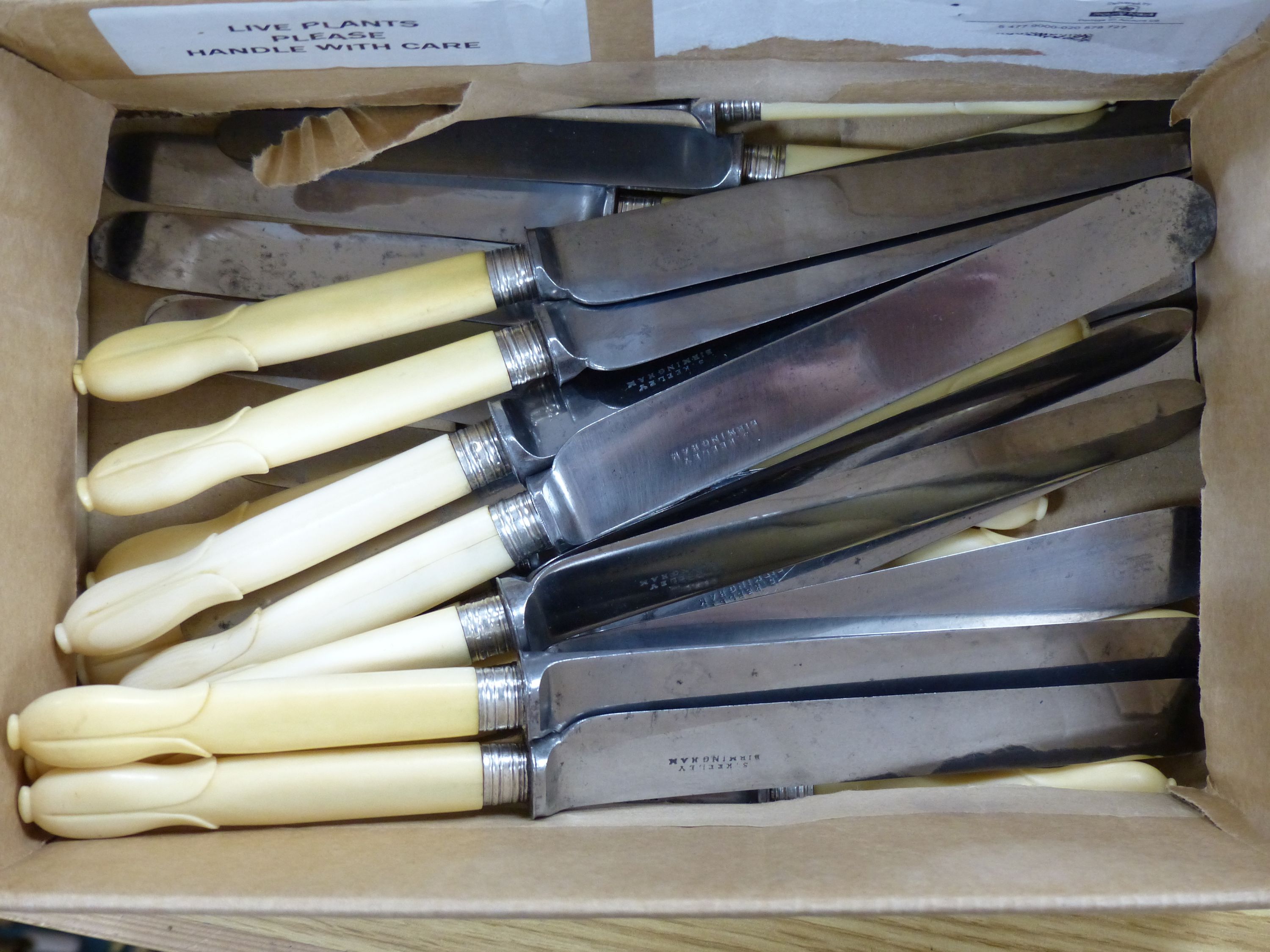 A set of 12 early 19th century ivory handle knives retailed by Samuel Keeley, Birmingham , 12 matching knives